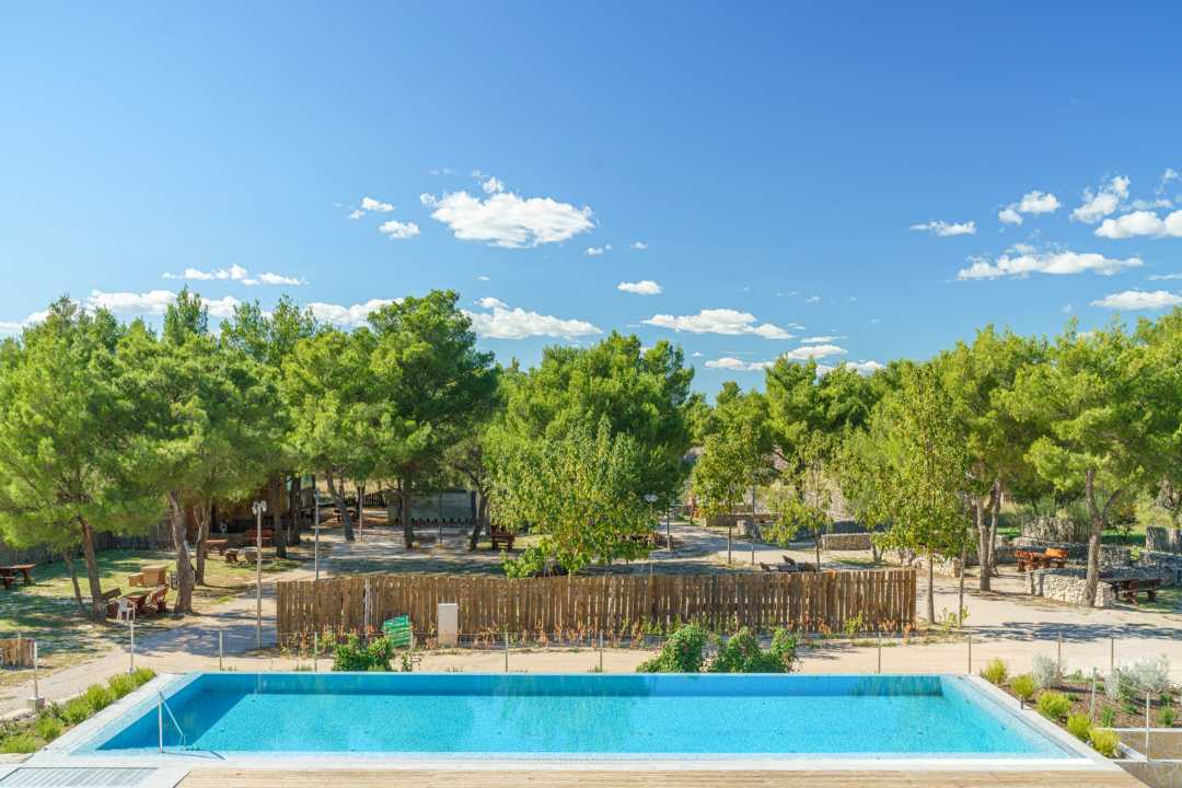 Outdoor pool terrace with sun loungers